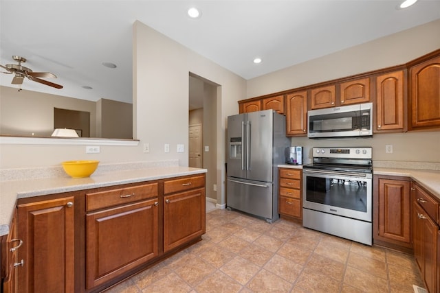 kitchen with appliances with stainless steel finishes, light countertops, brown cabinetry, a ceiling fan, and recessed lighting