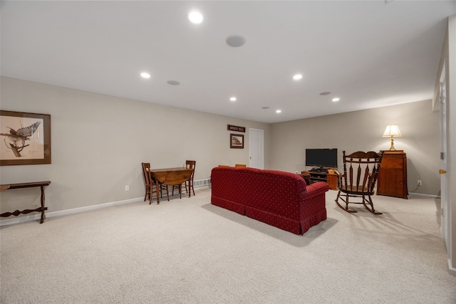 living room with light carpet, recessed lighting, and baseboards