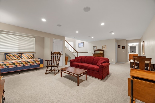 carpeted living room featuring stairway, recessed lighting, and baseboards