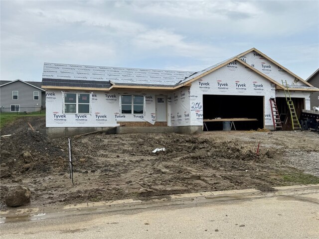 206 Endeavor Ave, Urbana, IA 52345 - unfinished property with an attached garage
