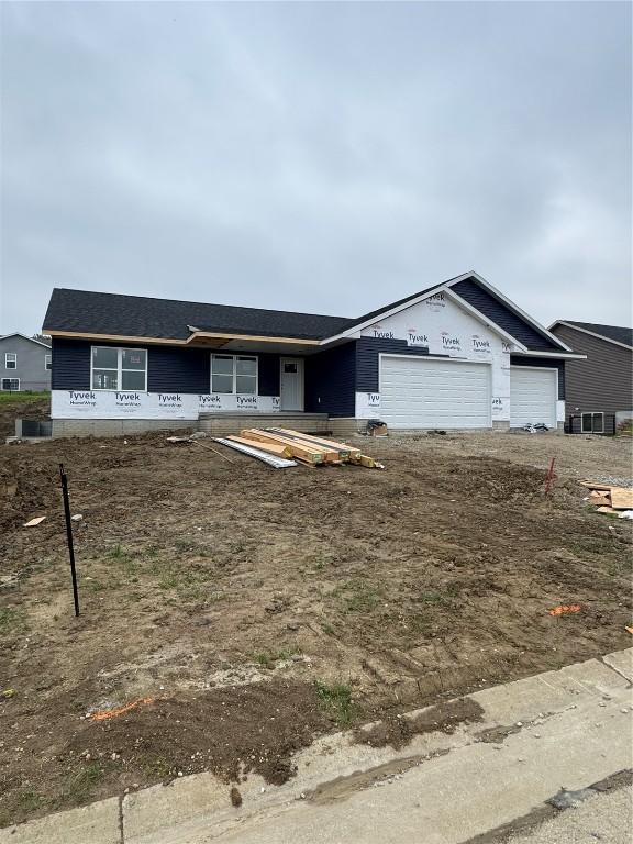206 Endeavor Ave, Urbana, IA 52345 - property in mid-construction featuring an attached garage