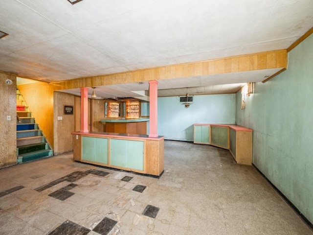 kitchen featuring wood walls
