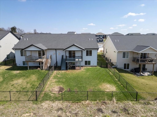 412 Dawson Dr, West Branch, IA 52358 - back of property with stairway, roof with shingles, a wooden deck, and a residential view