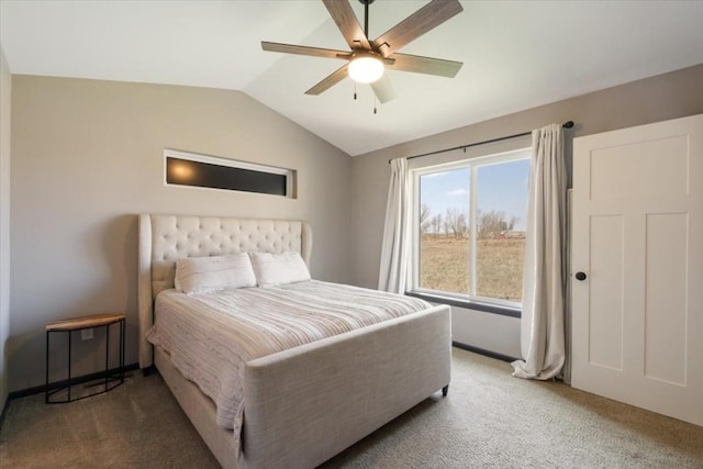 412 Dawson Dr, West Branch, IA 52358 - carpeted bedroom with vaulted ceiling, a ceiling fan, and baseboards