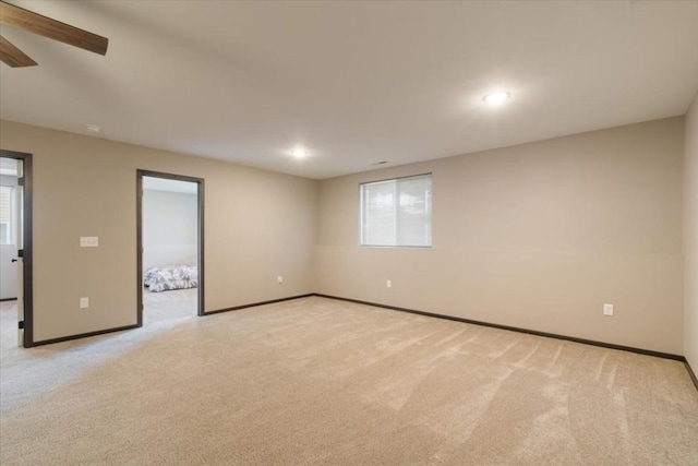 412 Dawson Dr, West Branch, IA 52358 - unfurnished room featuring light carpet, baseboards, plenty of natural light, and recessed lighting