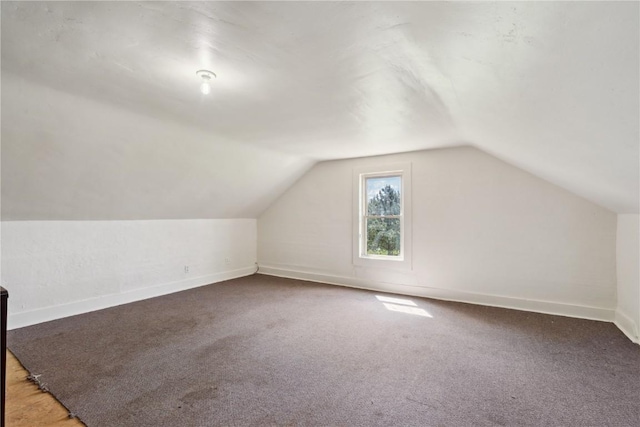 829 Union Ave, Lowden, IA 52255 - bonus room with lofted ceiling, baseboards, and carpet flooring