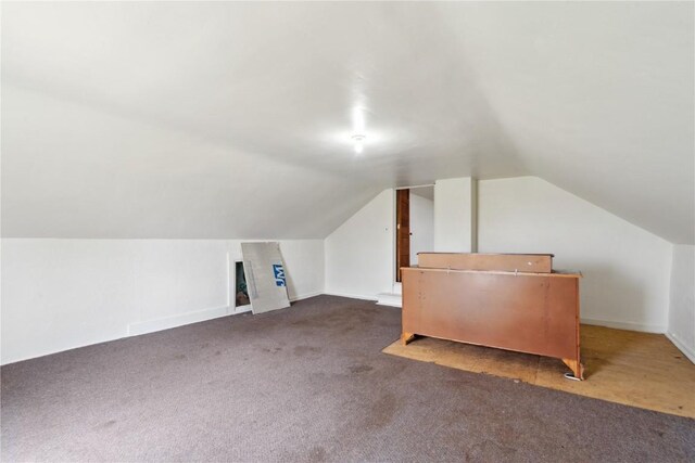 829 Union Ave, Lowden, IA 52255 - bonus room featuring carpet, vaulted ceiling, and baseboards