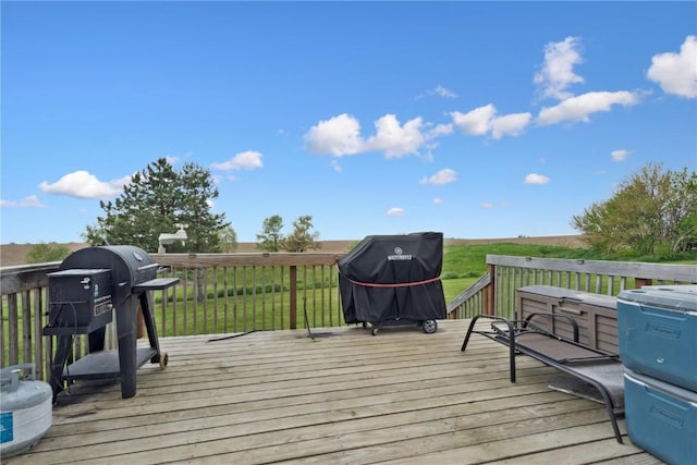 829 Union Ave, Lowden, IA 52255 - deck with area for grilling and a lawn