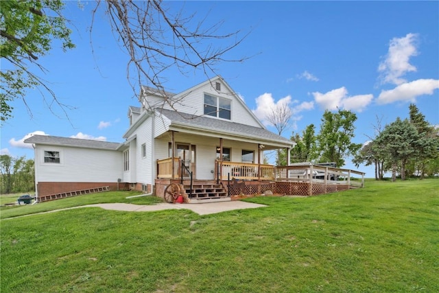 829 Union Ave, Lowden, IA 52255 - rear view of house featuring a yard, a patio area, and a deck