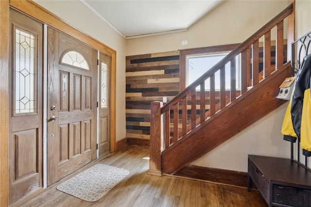 829 Union Ave, Lowden, IA 52255 - foyer with stairway, wood finished floors, plenty of natural light, and ornamental molding