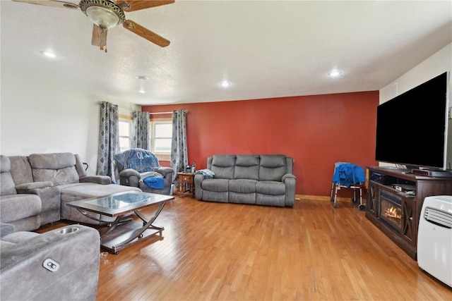 829 Union Ave, Lowden, IA 52255 - living room featuring light wood-style flooring, ceiling fan, recessed lighting, and baseboards