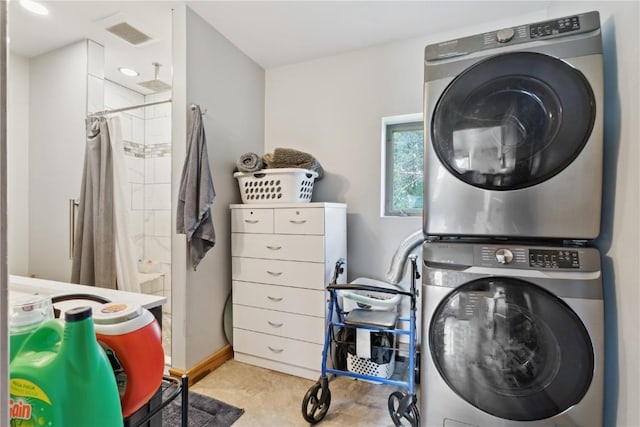 829 Union Ave, Lowden, IA 52255 - laundry area featuring stacked washer / drying machine
