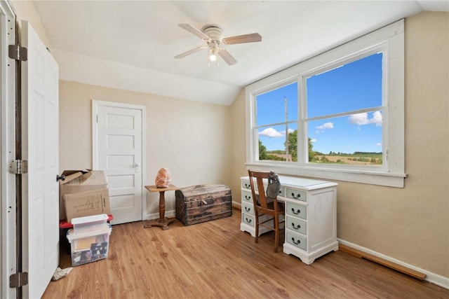 829 Union Ave, Lowden, IA 52255 - home office with vaulted ceiling, light wood-style floors, ceiling fan, and baseboards