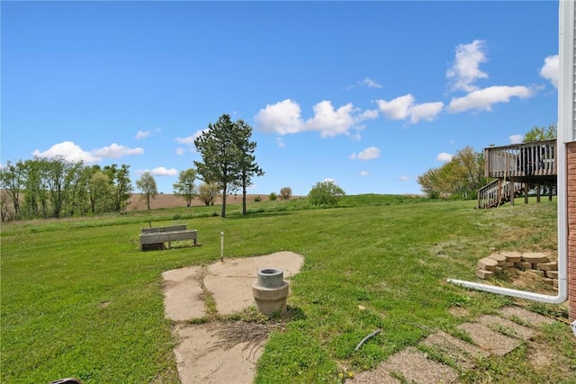 829 Union Ave, Lowden, IA 52255 - view of green lawn with stairway and a wooden deck