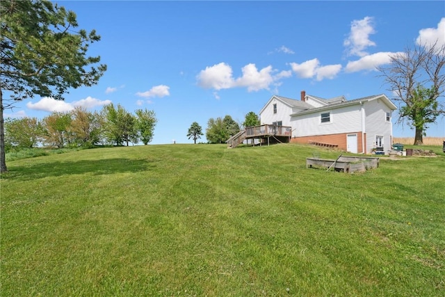 829 Union Ave, Lowden, IA 52255 - view of green lawn with a wooden deck and stairs