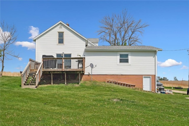 829 Union Ave, Lowden, IA 52255 - back of house featuring a deck, a yard, stairs, and a shingled roof