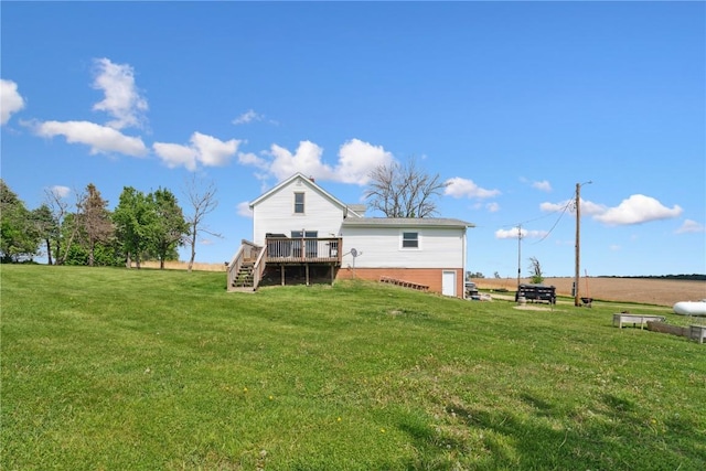 829 Union Ave, Lowden, IA 52255 - back of house featuring stairs, a deck, and a yard