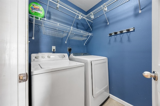 washroom with washing machine and dryer