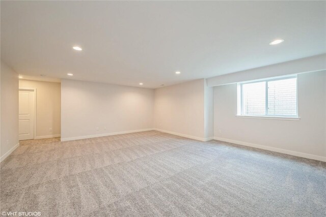 2559 Bluegrass St, Marion, IA 52302 - below grade area featuring light carpet, recessed lighting, and baseboards