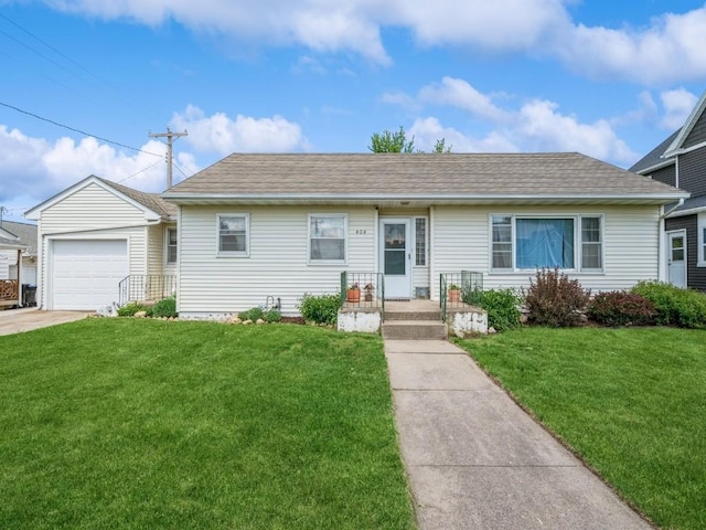 404 3rd St, Keystone, IA 52249 - view of front of property featuring a front lawn, a shingled roof, an attached garage, and driveway