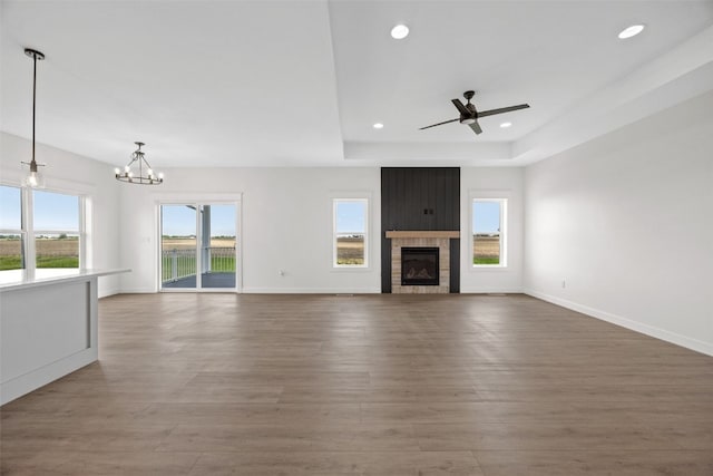 1356 Hickory Ridge Dr, Marion, IA 52302 - unfurnished living room featuring a ceiling fan, wood finished floors, a chandelier, recessed lighting, and a fireplace