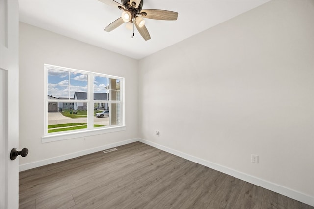 1356 Hickory Ridge Dr, Marion, IA 52302 - empty room featuring baseboards, wood finished floors, and ceiling fan