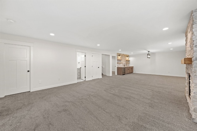 1356 Hickory Ridge Dr, Marion, IA 52302 - unfurnished living room with carpet floors, recessed lighting, baseboards, and bar