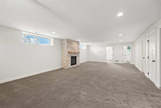 1356 Hickory Ridge Dr, Marion, IA 52302 - unfurnished living room featuring a stone fireplace, carpet flooring, recessed lighting, and baseboards