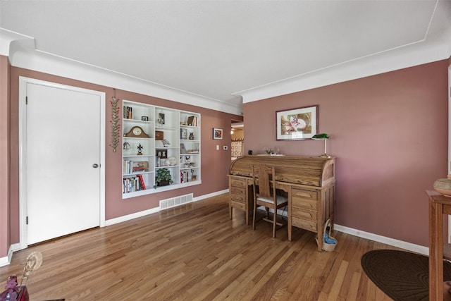 office area with wood finished floors and baseboards