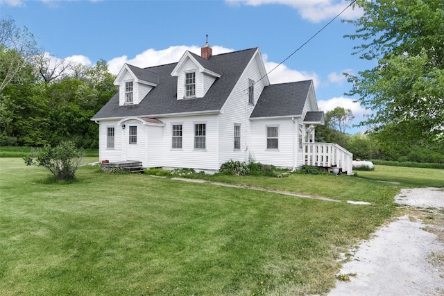 4378 480th St SE, Iowa City, IA 52240 - view of front of home with a chimney, a shingled roof, and a front yard