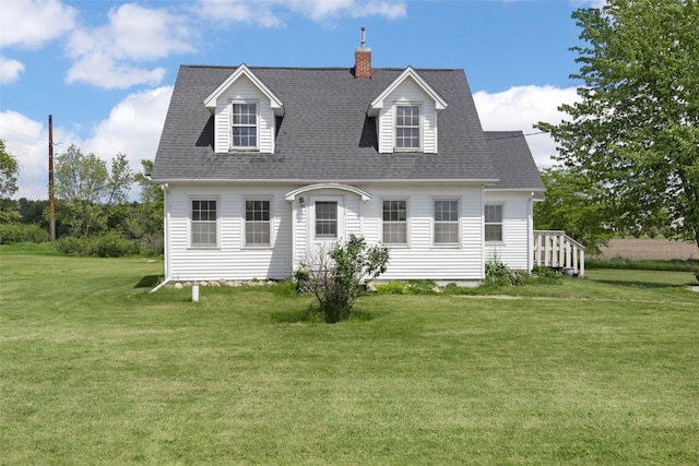 4378 480th St SE, Iowa City, IA 52240 - cape cod home featuring a front yard, a chimney, and a shingled roof