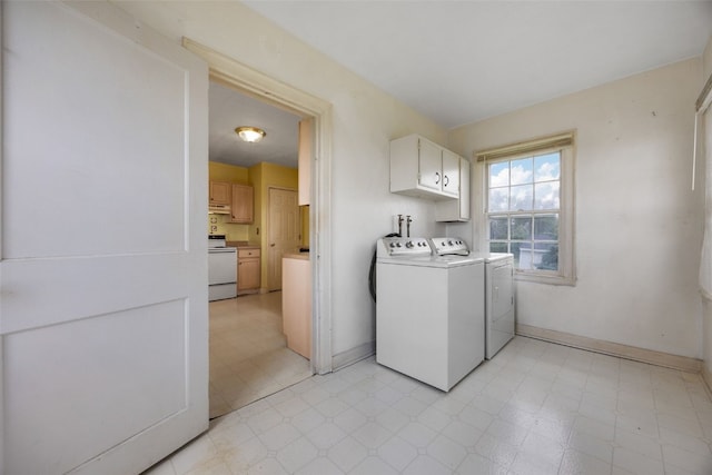 4378 480th St SE, Iowa City, IA 52240 - washroom with washer and dryer, cabinet space, light floors, and baseboards