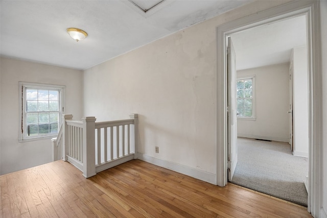 4378 480th St SE, Iowa City, IA 52240 - empty room featuring light wood-type flooring, attic access, and baseboards