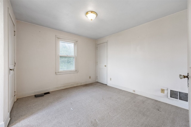 4378 480th St SE, Iowa City, IA 52240 - empty room with light colored carpet and baseboards