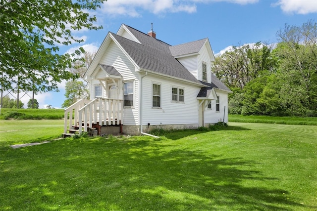 4378 480th St SE, Iowa City, IA 52240 - view of property exterior with a lawn, a shingled roof, and a chimney