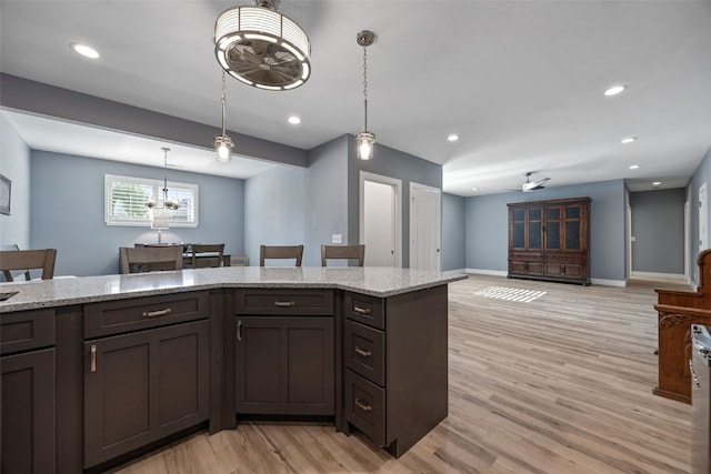 kitchen with ceiling fan, light wood-style floors, pendant lighting, baseboards, and recessed lighting