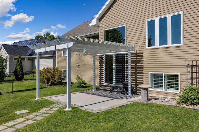 back of property featuring a pergola and a patio area
