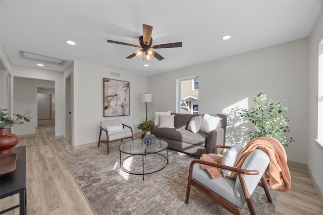 841 S 7th St, Iowa City, IA 52240 - living room with light wood finished floors, a ceiling fan, baseboards, and recessed lighting