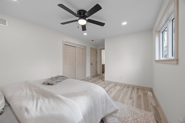 841 S 7th St, Iowa City, IA 52240 - bedroom featuring light wood-style floors, baseboards, recessed lighting, ceiling fan, and a closet