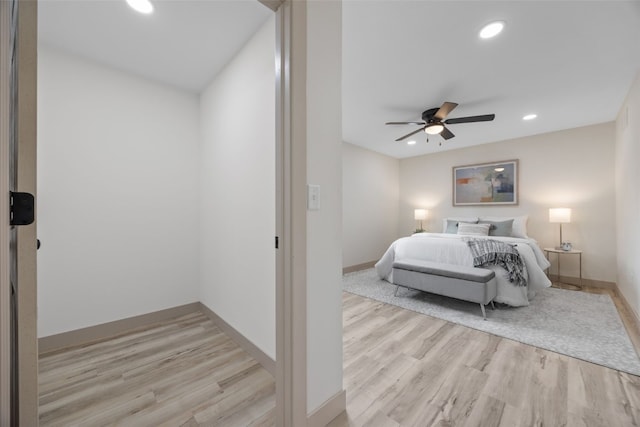 841 S 7th St, Iowa City, IA 52240 - bedroom with light wood finished floors, recessed lighting, baseboards, and a ceiling fan