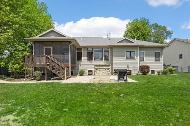 302 6th St NE, Mount Vernon, IA 52314 - rear view of house with a sunroom, a patio, a lawn, and stairs