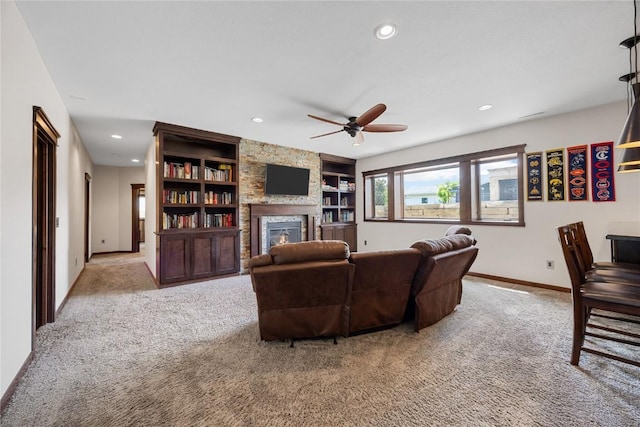 302 6th St NE, Mount Vernon, IA 52314 - living area featuring carpet, a ceiling fan, a fireplace, recessed lighting, and baseboards
