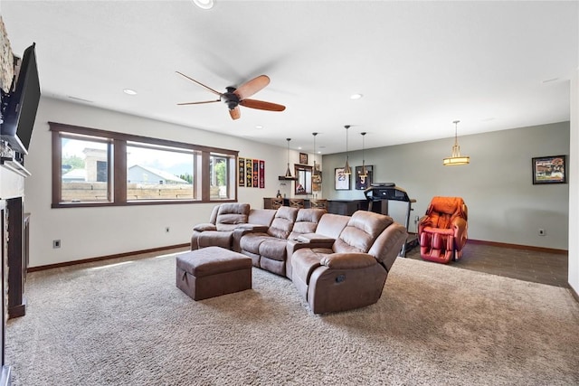 302 6th St NE, Mount Vernon, IA 52314 - carpeted living room featuring a ceiling fan, baseboards, recessed lighting, and a fireplace