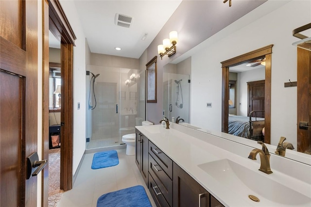 302 6th St NE, Mount Vernon, IA 52314 - ensuite bathroom featuring a stall shower, double vanity, tile patterned flooring, toilet, and recessed lighting
