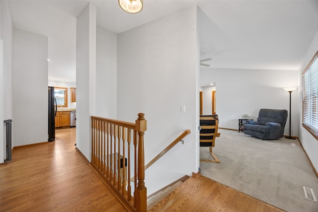 1451 Chamberlain Dr, Iowa City, IA 52240 - corridor with an upstairs landing, plenty of natural light, and baseboards