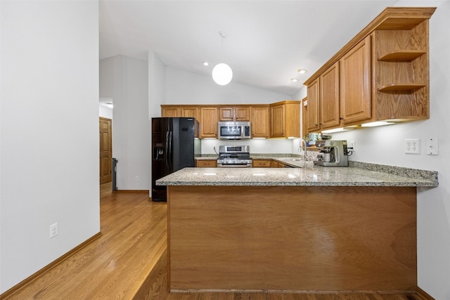 1451 Chamberlain Dr, Iowa City, IA 52240 - kitchen featuring appliances with stainless steel finishes, open shelves, a peninsula, brown cabinetry, and light stone counters