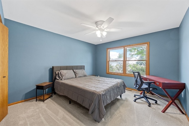 1451 Chamberlain Dr, Iowa City, IA 52240 - carpeted bedroom featuring baseboards and a ceiling fan