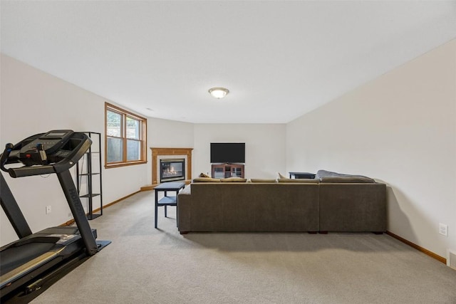 1451 Chamberlain Dr, Iowa City, IA 52240 - living room with light carpet, a glass covered fireplace, and baseboards