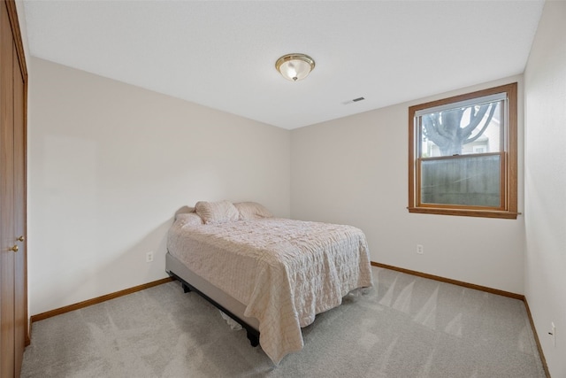 1451 Chamberlain Dr, Iowa City, IA 52240 - bedroom featuring baseboards and light carpet