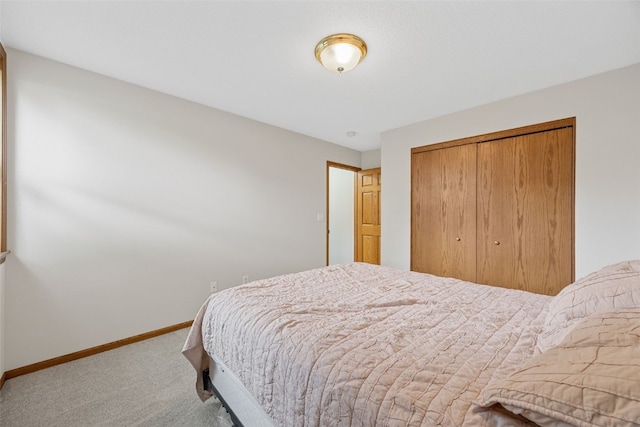 1451 Chamberlain Dr, Iowa City, IA 52240 - bedroom with carpet flooring, baseboards, and a closet